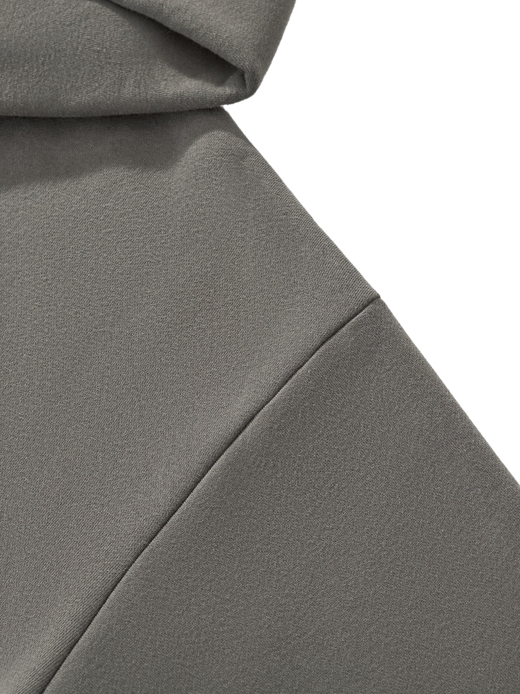 Detail view of the HAVEN™ Boxy Hoodie showcasing the drop shoulder design in a soft gray fabric, unisex boxy hoodie.
