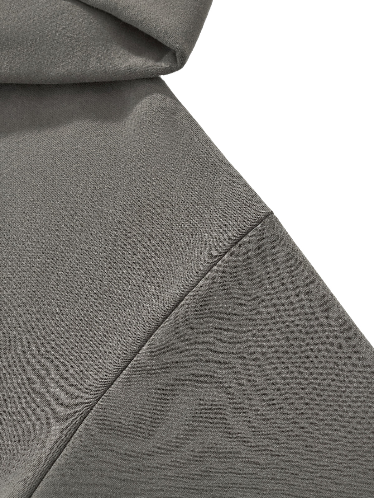 Detail view of the HAVEN™ Boxy Hoodie showcasing the drop shoulder design in a soft gray fabric, unisex boxy hoodie.