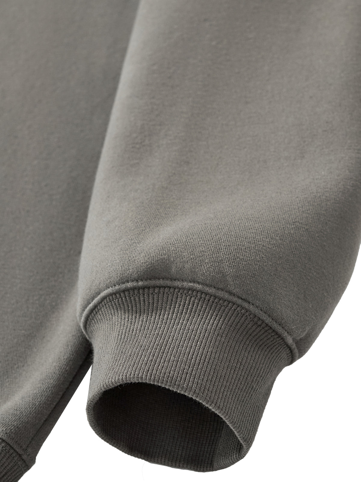 Detail of the HAVEN™ Boxy Hoodie showcasing its cuff and sleeve design in gray, featuring a unisex boxy hoodie look.