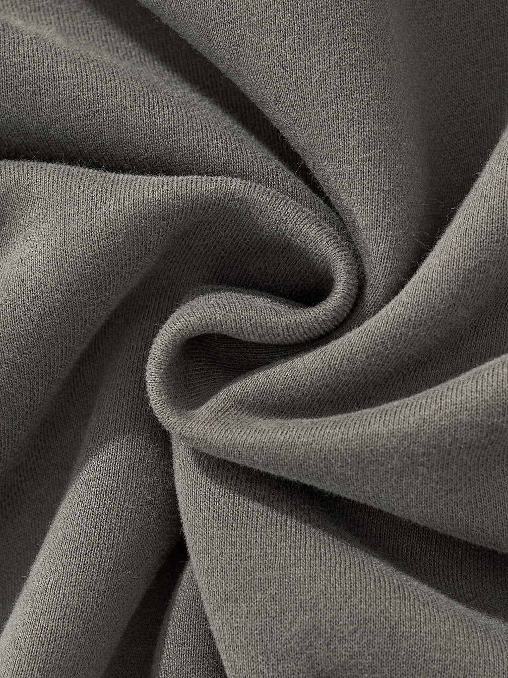 Close-up of soft, gray fabric showcasing the texture of HAVEN™ Boxy Hoodie, unisex boxy hoodie material.
